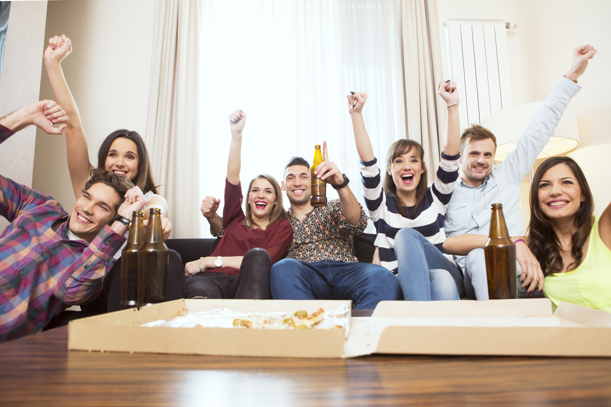 Students watching TV cheering