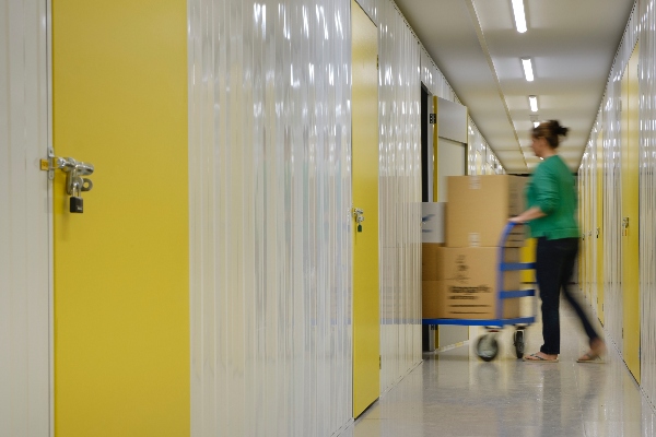 Someone moving items into a business storage unit