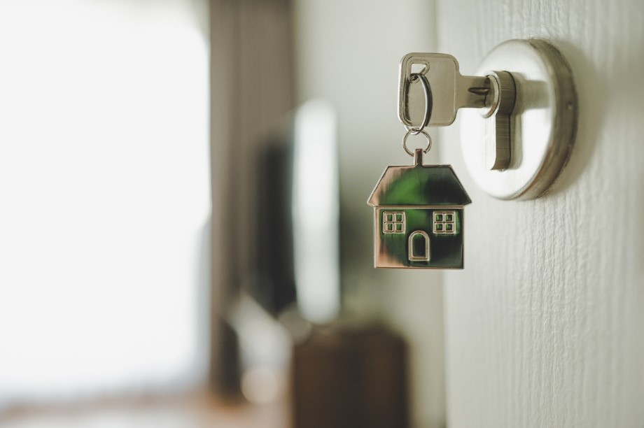 Key in door with house keyring